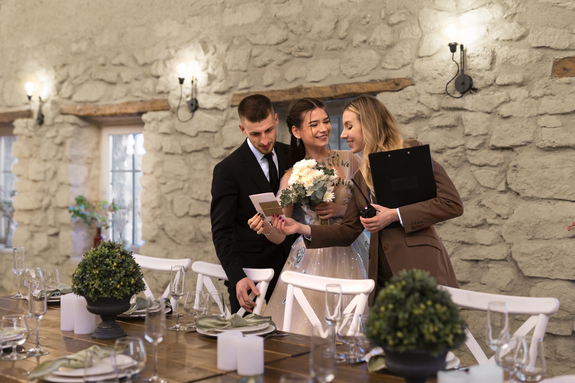 female-wedding-planner-working-with-bride-groom female-wedding-planner-working-with-bride-groom
